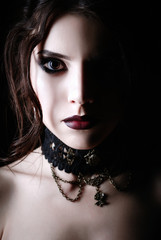 Closeup portrait of beautiful young goth girl