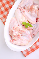 raw chicken wings on a white background