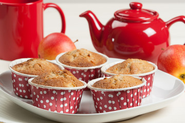 Homebaked Apple Muffins In Paper Cases. Red Teapot.