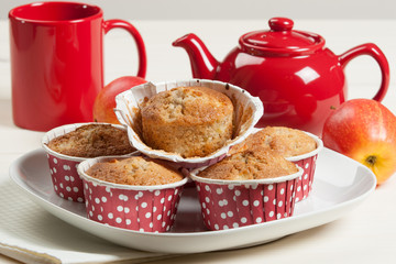 Homebaked Apple Muffins In Paper Cases. Red Teapot.