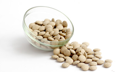 herbal medical pills on white background.