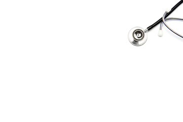 Black stethoscope on white background with copy space