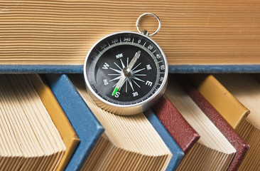 compass and old books