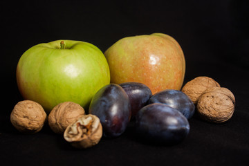 apple and plum and walnuts