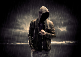 Anonymous terrorist in hoodie at night