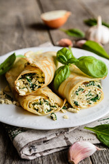 Savory pancakes with tofu, spinach, onion and garlic