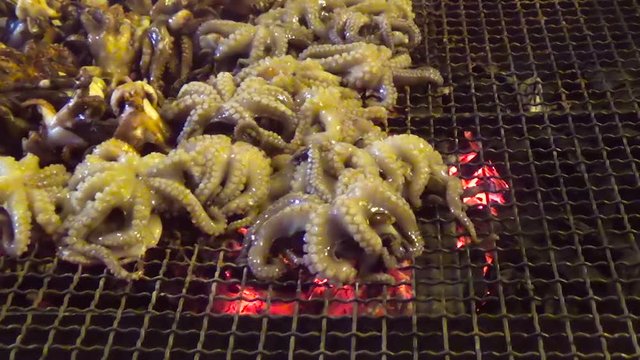octopus cooked on the barbecue during the course of a festival in Mola di Bari. Apulia - Italy