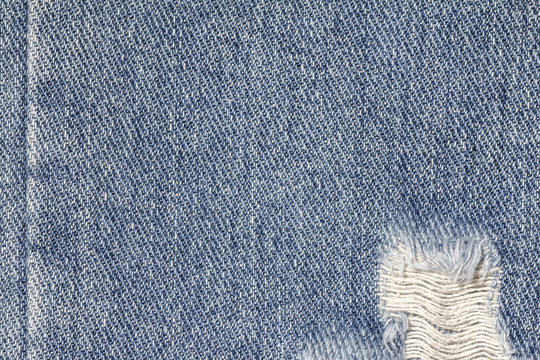 Denim jeans texture or denim jeans background with old torn. Old grunge vintage denim jeans. Stitched texture denim jeans background of fashion jeans design.
