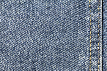 Denim jeans texture or denim jeans background with seam. Old grunge vintage denim jeans. Stitched texture denim jeans background of fashion jeans design.