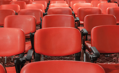 Obraz premium rows of red chairs in empty conference hall