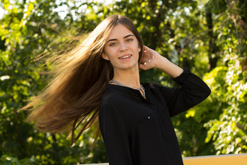 Young woman touching her hair