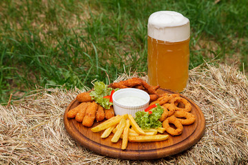 A glass of beer and snack to beer