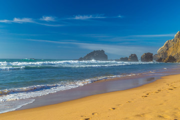 Adraga Beach (Praia da Adraga) at sunset in Portugal
