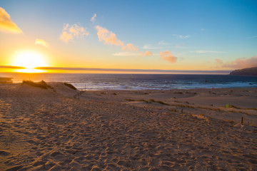 Obraz premium Sand dunes at Crismina beach (Praia da Crismina) at sunset, Port