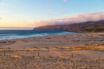 Sand dunes at Crismina beach (Praia da Crismina) at sunset, Portugal