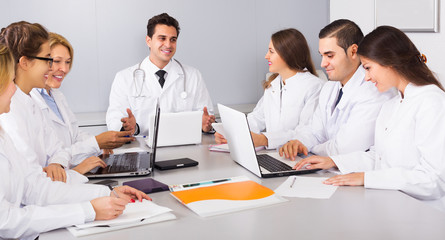 Fototapeta premium Interns and professor cooperating