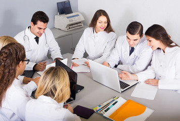 Health-care workers and head physician at colloquium in clinic