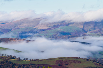 Cloud mist on hills in temperature inversion.