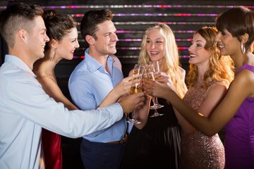 Group of friends toasting glasses of champagne © WavebreakmediaMicro