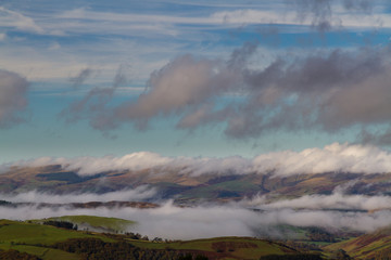 Cloud mist on hills in temperature inversion.