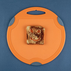 Happy toast on a cutting board