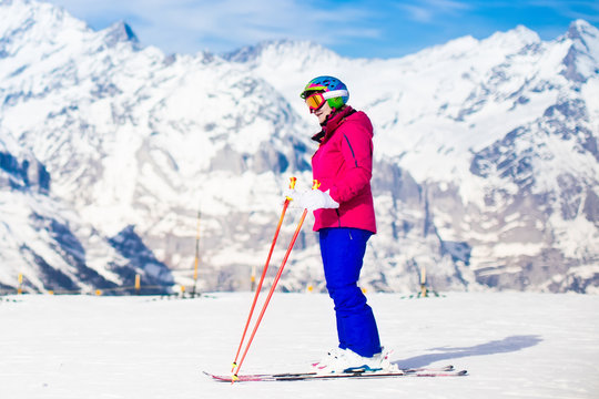 Young woman skiing in the mountains.