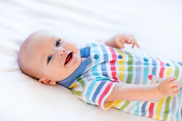 Baby boy in bed