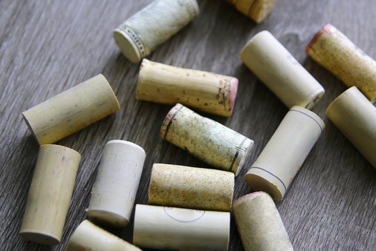 Bunch Of Wine Corks On Wooden Table. No Labels