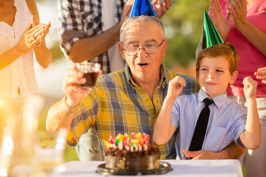 Grandson celebrating grandfathers birthday.