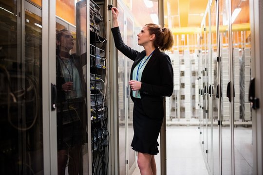 Technician examining server