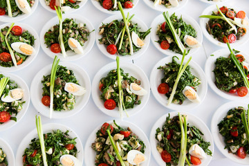 Many plates of vegetable salad