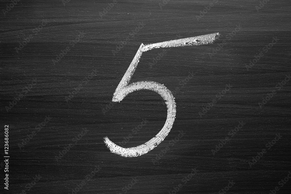 Wall mural number five enumeration written with a chalk on the blackboard