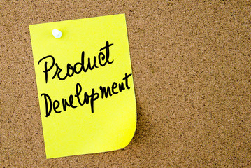 Product Development text written on yellow paper note