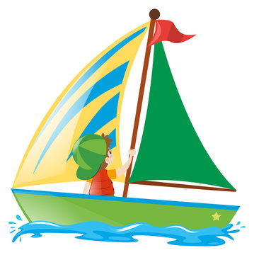 Boy sailing boat in the sea