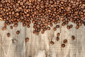 Coffee beans on wooden background