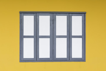 close up window and wall yellow background.