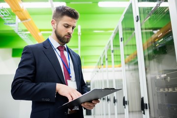 Technician looking at clipboard