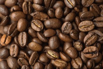 Brown coffee beans, closeup macro for background and texture
