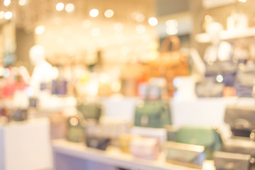 blurred image of shopping mall and people .