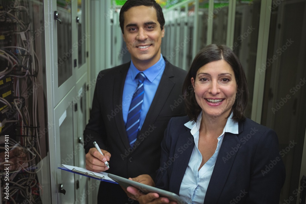 Poster portrait of technicians analyzing server