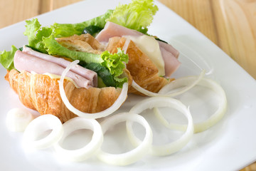 Croissant sandwich and cheese, ham with vegetable delicious brea
