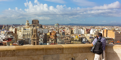 Valencia panorama from the observation deck of main city church. Photographer looking at urban panorama of European city.