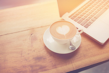 Coffee cup in coffee shop - vintage style effect picture