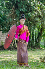 Beautiful Thai girl in Thai dress identity  traditional costume,