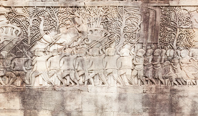 Bas-reliefs sandstone shows a Khmer army on the march in Angkor Thom. Siem Reap. Cambodia