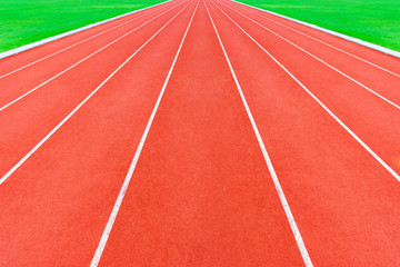 Red running tracks in sport stadium