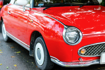 Obraz na płótnie Canvas close up of a red vintage car