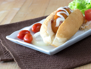 hotdog with ketchup mustard and vegetable