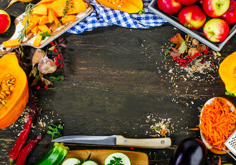 Autumn vegetables on a dark wooden background. Flat lay