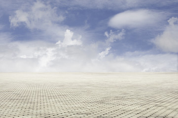 Fototapeta na wymiar patterned paving tiles with blue sky background